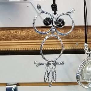 Silver Owl necklace on 36" leather cord.
